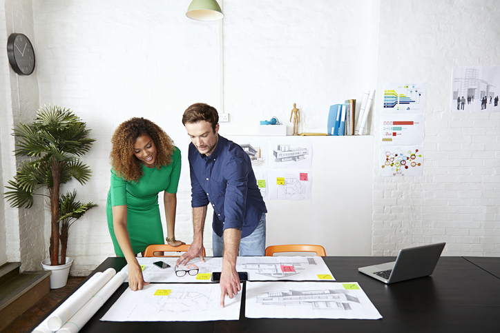 Two individuals undertaking participating in a leadership assessment