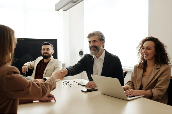 An executive leader showcasing leadership skills and shaking hands