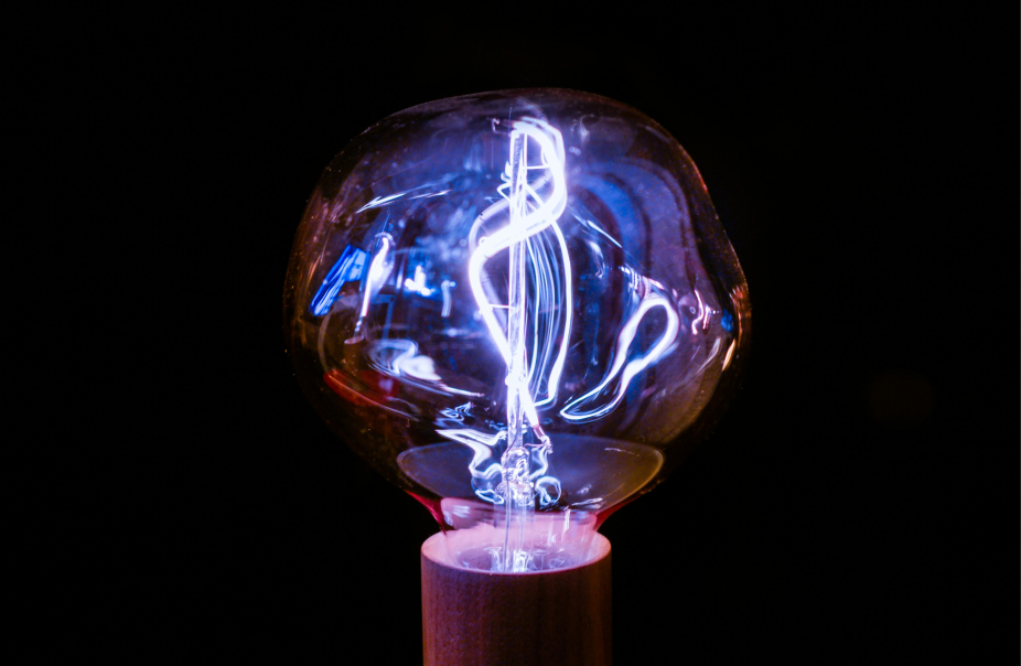 Lightbulb with bright lights in purple